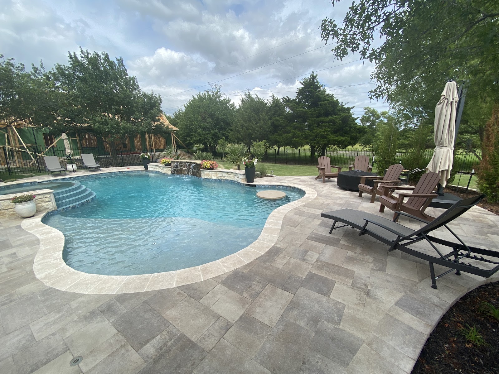 Modern Geometric Pool with Stone Patio